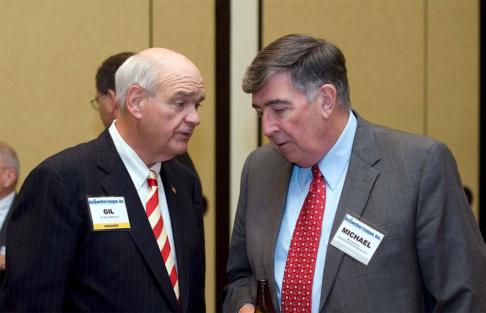 Bellwether Class of 2010 Honoree Gil Minor III huddles with Michael Bohon.