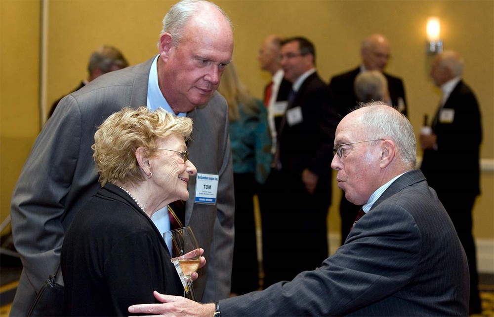 Bellwether League Founding Secretary Bud Bowen (right) congratulates Phyllis Soth on behalf of her husband Don Soth as Bellwether League Founding Board Member Tom Hughes looks on.