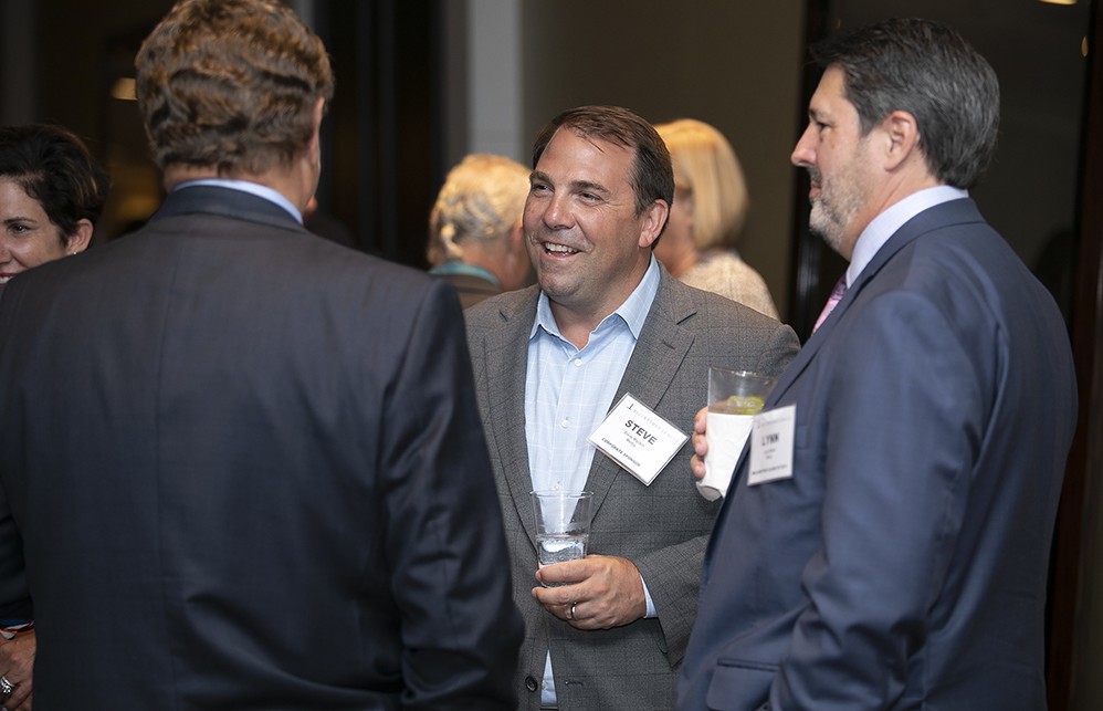 Mercy’s Lynn Britton (Bellwether Class of 2013) (far right), Steve Mackin and Mike McCurry (Bellwether Class of 2015) (back to camera).