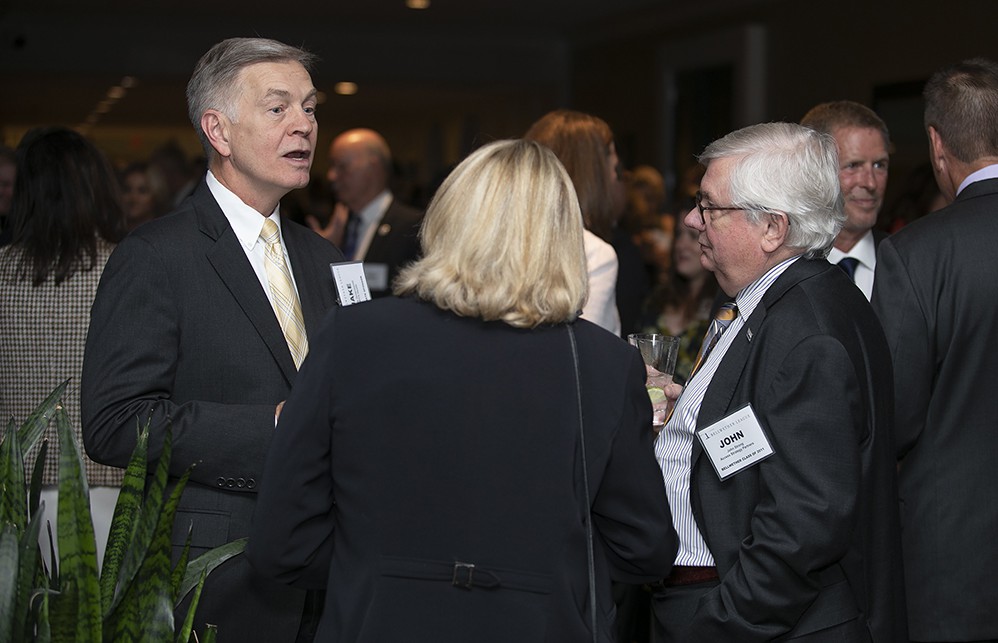 AMITA Health’s Jacob Groenewold (left) talks with Access Strategy Partners’ John Strong (Bellwether Class of 2011) and Greenhealth Exchange’s Mary Starr (center, back to camera) (Bellwether Class of 2018).