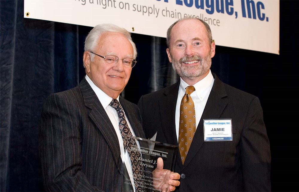 Bellwether Class of 2011 Inductee Daniel J. Dryan accepts his Beacon award from Jamie Kowalski.