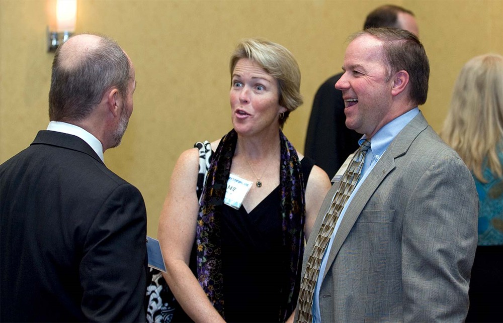 Jamie Kowalski converses with Founding/Platinum Sponsor MedAssets’ Jane & Kevin McCole.