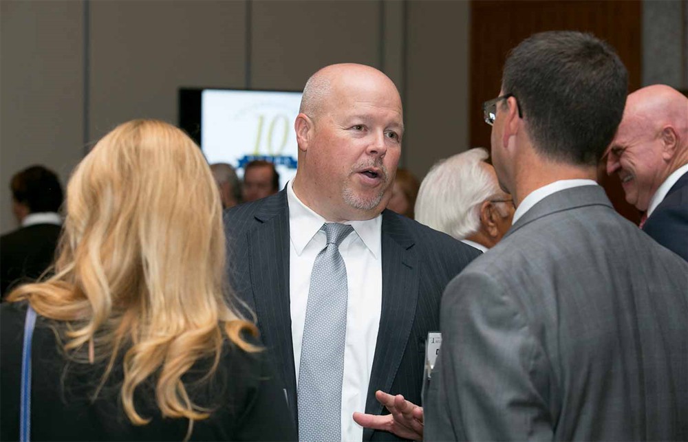 Premier’s David Hargraves with Blue.Point’s Mark Scagliarini (right, back to camera) and his wife Carie Scagliarini (left, back to camera).