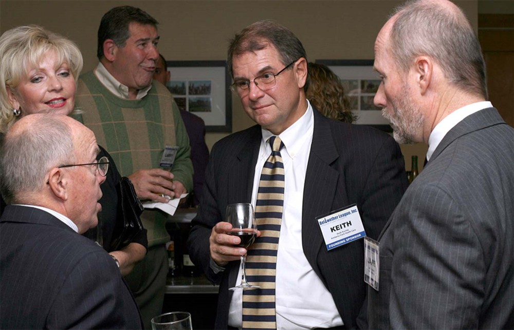 Bellwether League Secretary Robert P. (Bud) Bowen converses with Kimberly-Clark Health Care's Susan Meyer and Keith Kuchta with Bellwether League Chairman  Jamie C. Kowalski