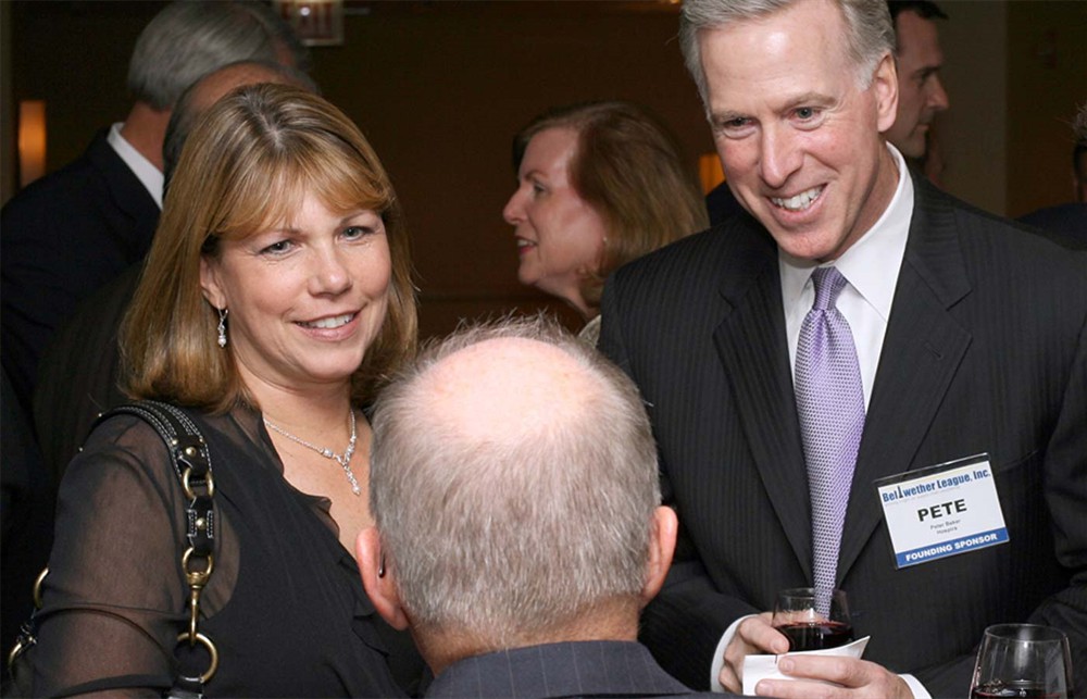 Hospira's Pete Baker (right) and wife Nancy Retig (left) enjoy a lighter moment with Bellwether League Secretary Bud Bowen (center foreground). 